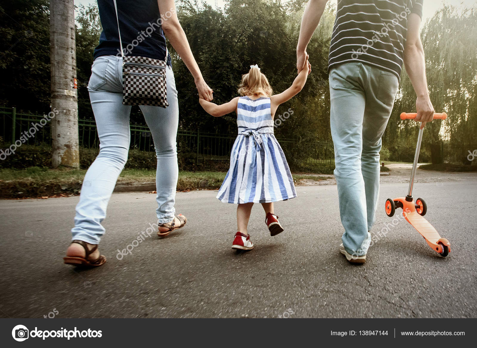 Parents Holding Hands With Daughter Stock Photo By C Sonyachny