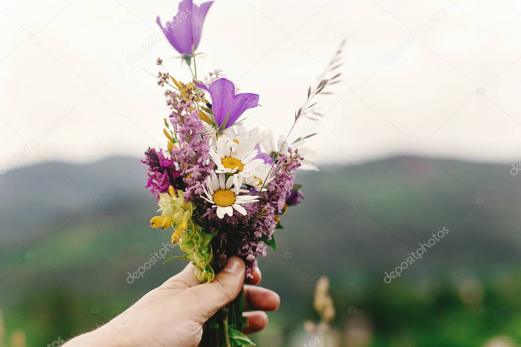  woman holding  wildflowers