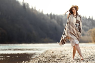 woman hipster walking on river beach clipart