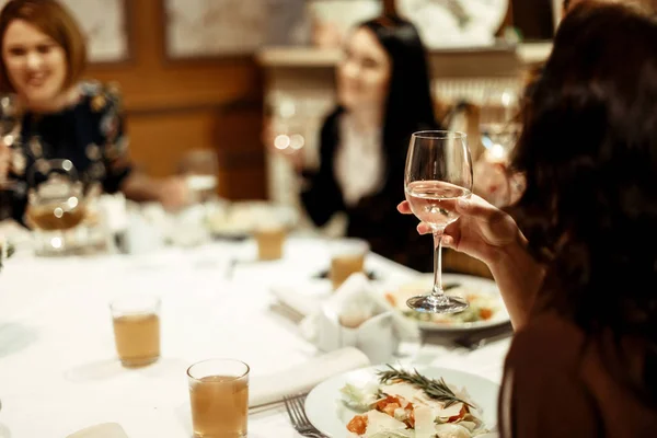 Woman holding glass of champagne — Stock Photo, Image