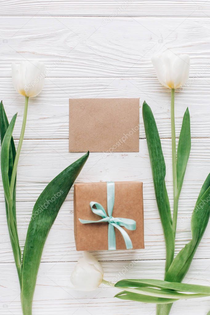 greeting card, present box and tulips