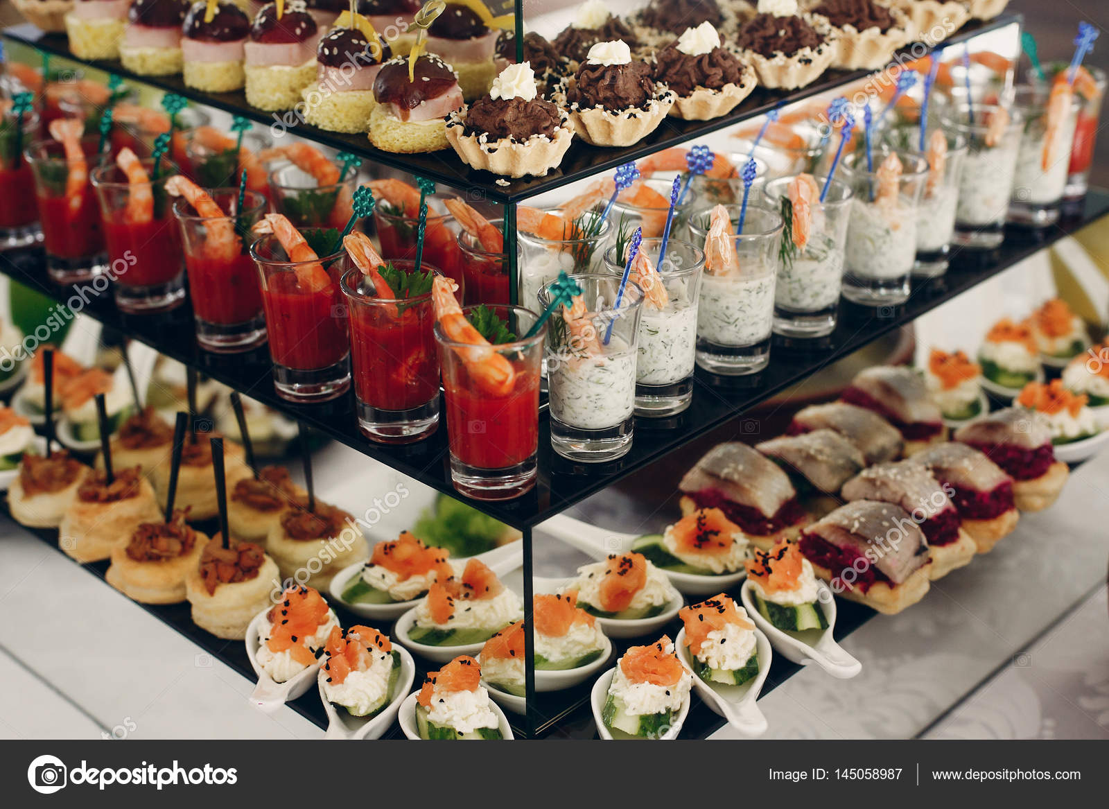 Snacks on wedding reception table Stock Photo by ©Sonyachny 145058987