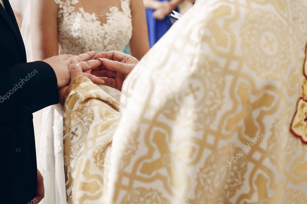 Bride and groom exchanging rings 