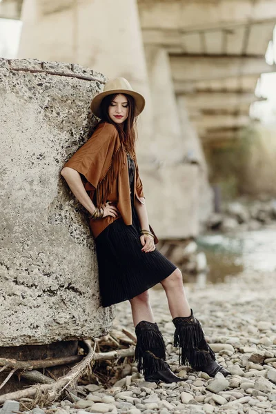 Girl in hat and fringe poncho — Stock Photo, Image