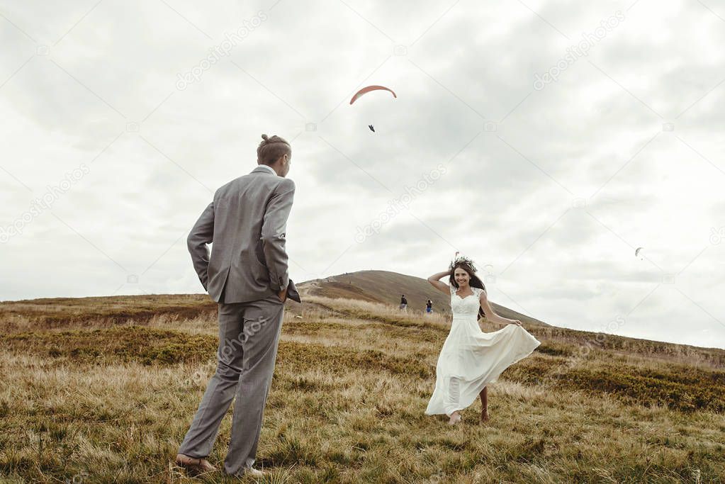 couple having fun at boho wedding