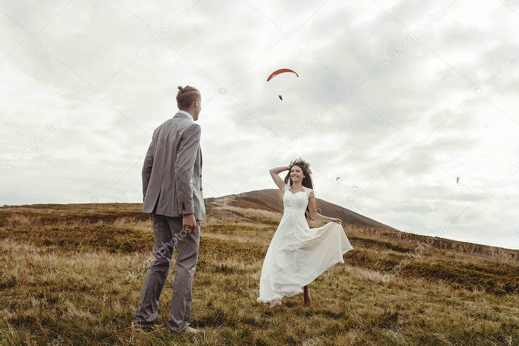 couple having fun at boho wedding