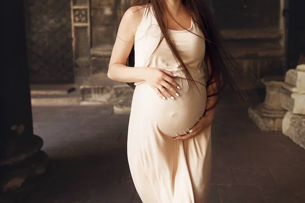 Pregnant woman holding her big belly — Stock Photo, Image