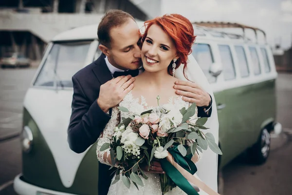 Groom kissing his bride in neck — Stock Photo, Image