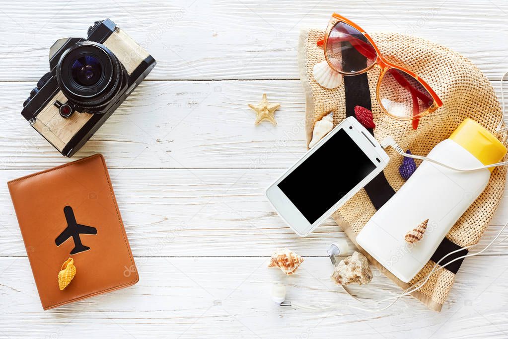 hat, phone, sunglasses and sunscreen