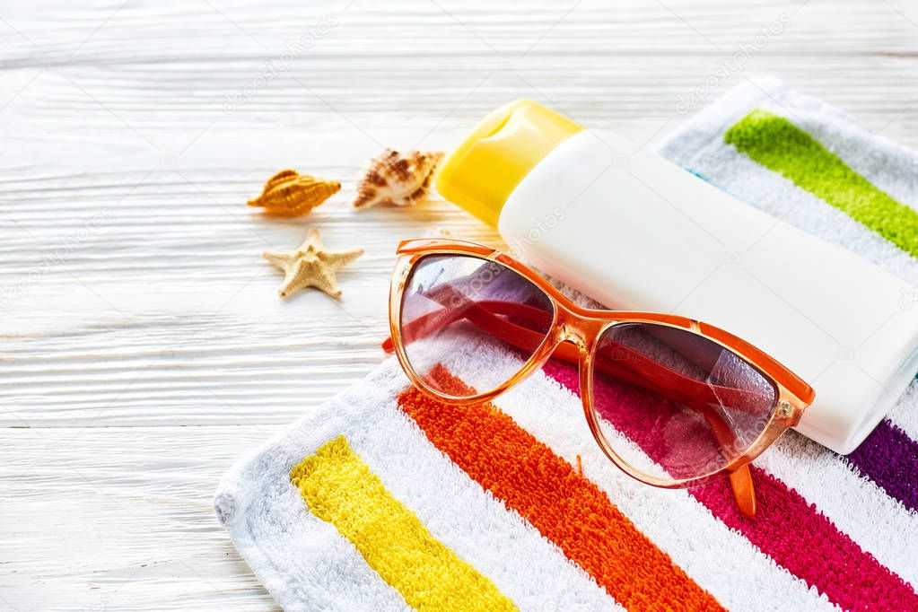 sunglasses and colorful shells