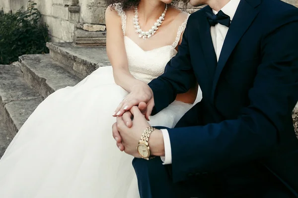 Bride and groom gently hugging — Stock Photo, Image