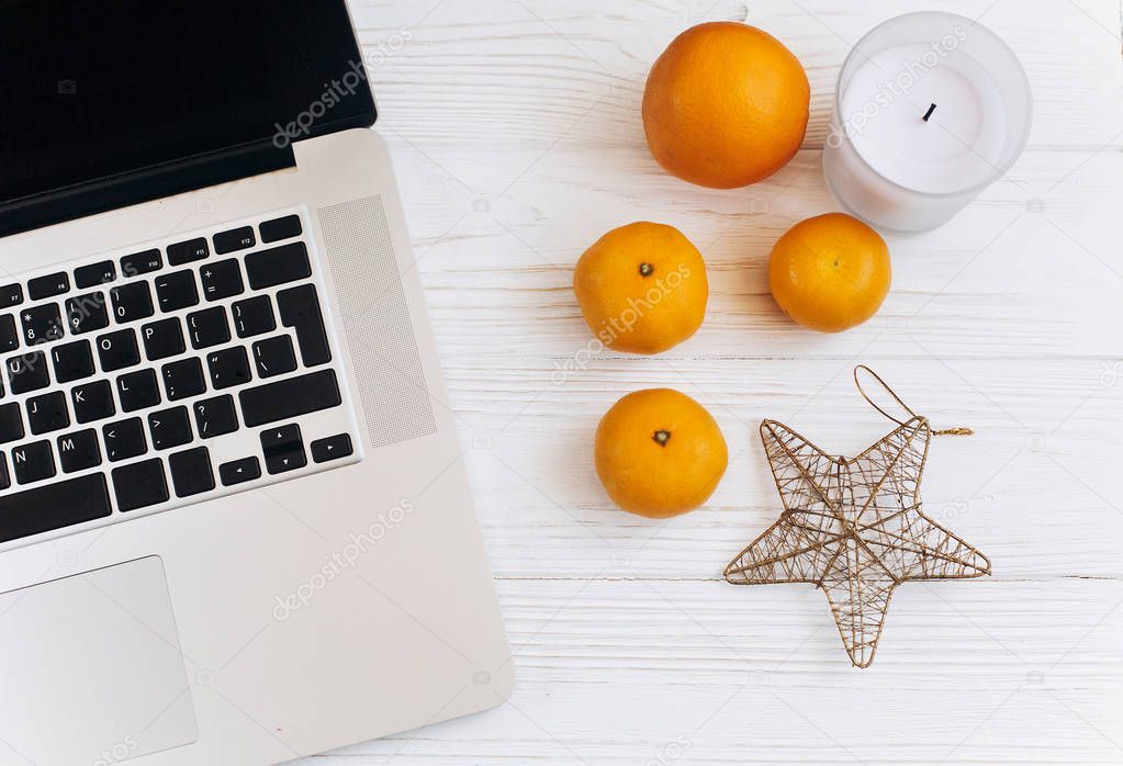 laptop, oranges, star and candle