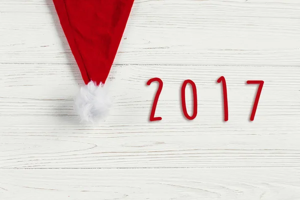 Tarjeta de Navidad con sombrero de santa — Foto de Stock