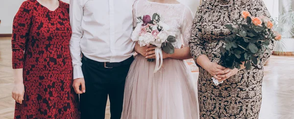 Wedding couple taking photo with family — Stock Photo, Image