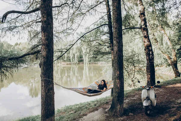 Female freelancer on hammock — Stock Photo, Image