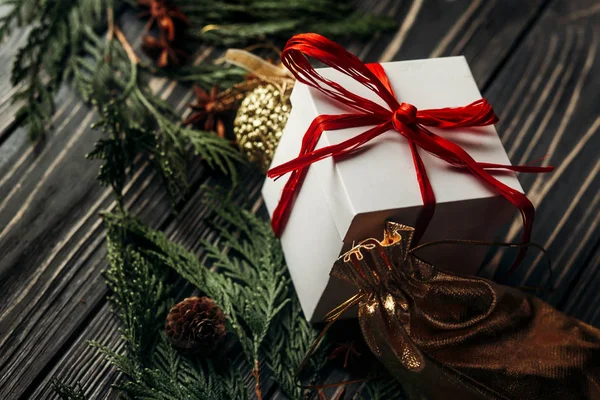 Christmas presents and golden ornaments — Stock Photo, Image