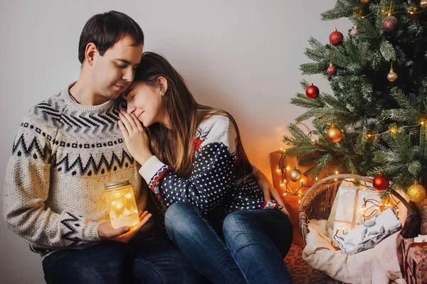Happy Couple Stylish Sweaters Holding Lantern Light Gently Hugging — Stock Photo, Image