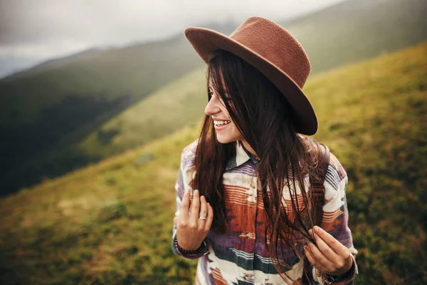 Stylish Traveler Hipster Girl Hat Backpack Windy Hair Smiling Mountains — Stock Photo, Image