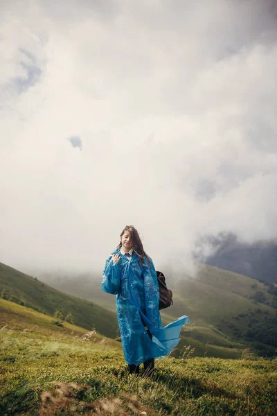Traveler Hipster Girl Blue Raincoat Backpack Exploring Misty Mountains Space — Stock Photo, Image