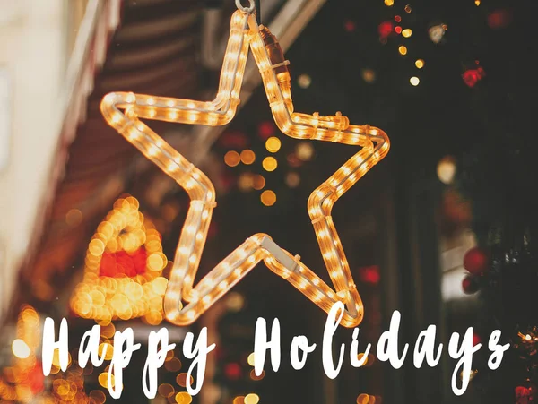 Happy Holidays text sign on stylish christmas golden star illum — Stock fotografie