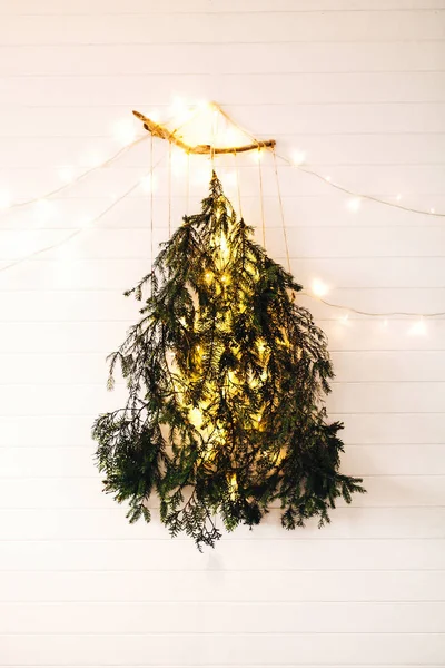 Modern christmas tree made of pine branches with golden festive — Stock Photo, Image