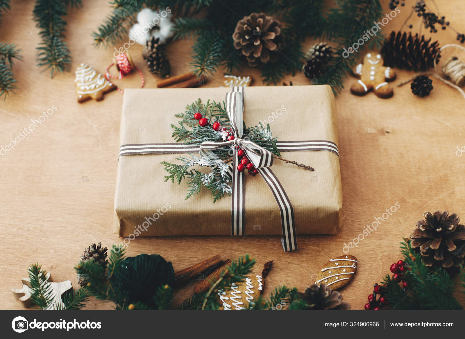 Merry Christmas. Stylish rustic christmas gift and pine branche Stock Photo  by ©Sonyachny 324906966