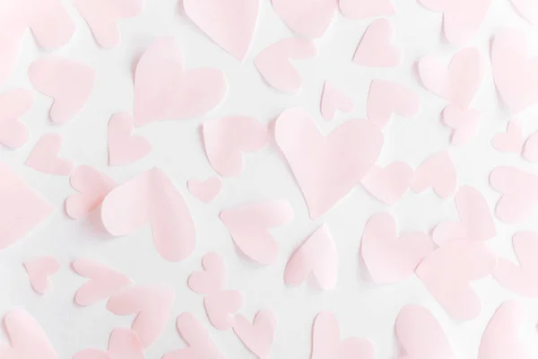 Cute pink pastel hearts on white paper  background. Flat lay. Ha — 스톡 사진