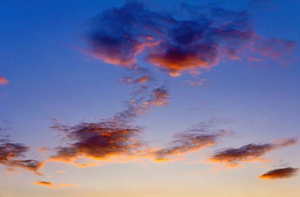 Colorful clouds on sunset sky background — Stock Photo, Image