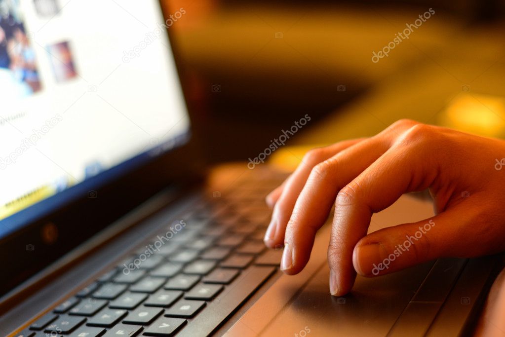 Hand on laptop touchpad business concept