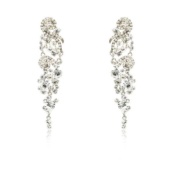 Pair of silver diamond earrings isolated on white — Stock Photo, Image