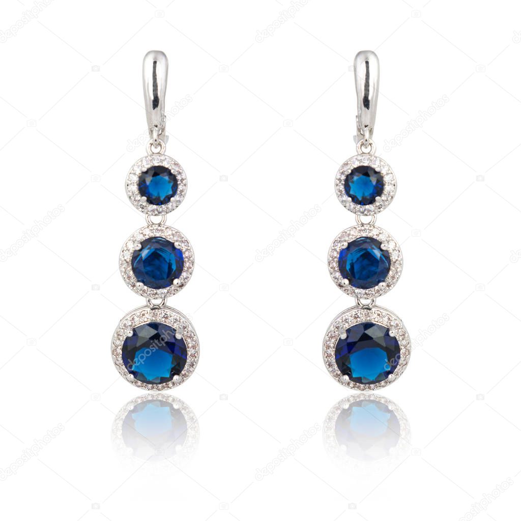 Pair of sapphire earrings isolated on white