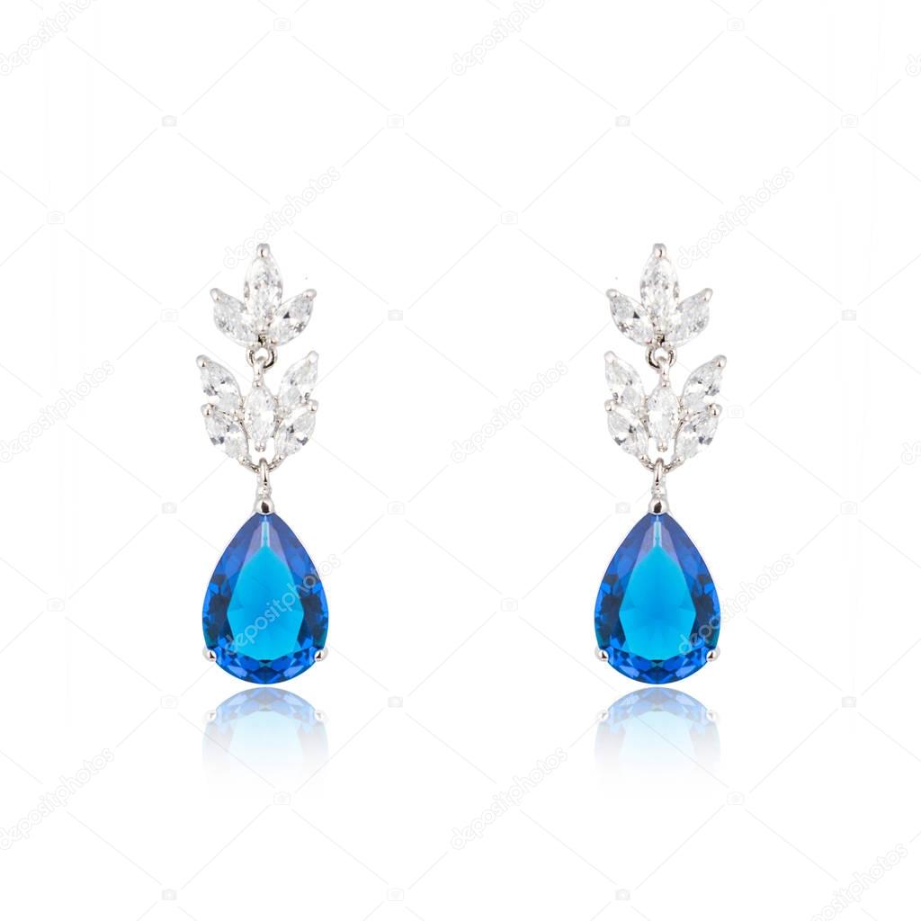 Pair of sapphire earrings isolated on white