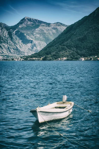 Lonely boat on a water in a Boka Kotor bay Stock Photo