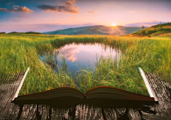 Mountain lake on the pages of an open book — Stock Photo, Image