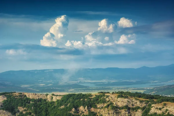 Panoramic view of Crimea mountain valley with beautiful clouds in a sky. Wild nature of Ukraine.