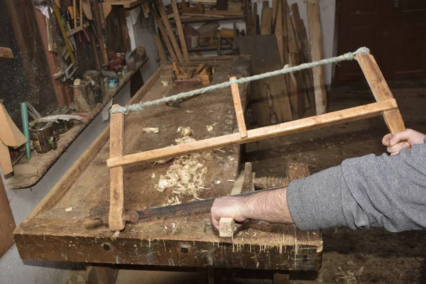 Carpenter working with plane on wooden — Stock Photo, Image