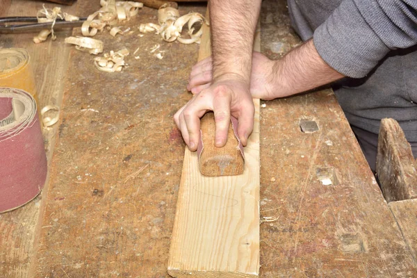 Carpenter working. Carpenter tools on wooden table with sawdust. Carpenter workplace