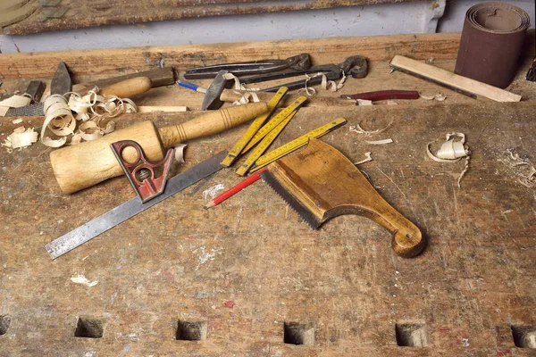 Carpenter working. Carpenter tools on wooden table with sawdust. Carpenter workplace — Stock Photo, Image