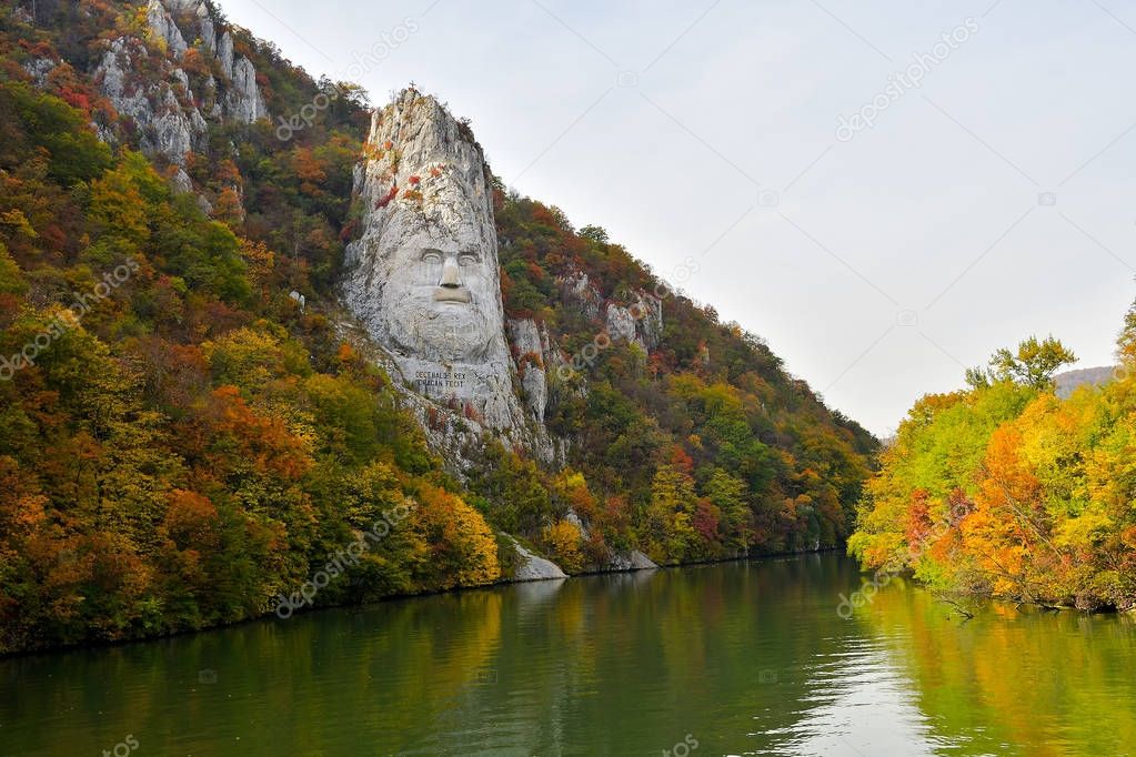 Decebal's Head sculpted in rock, Danube Gorges, Romania, autumn landscape