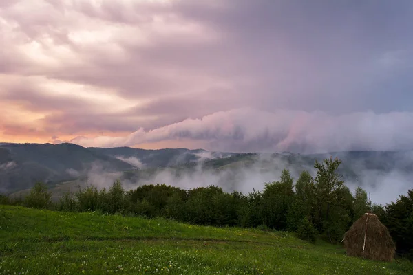 Beautiful from the nature with fog and clouds at sunset