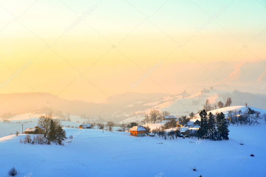 Winter landscape with a mountain valley. on sunrise