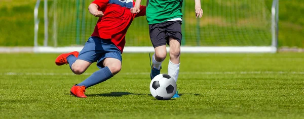 Boys kicking soccer ball. Youth soccer game for kids — Stock Photo, Image