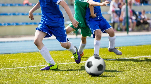 Boys play soccer match on sports field. Youth football league — Φωτογραφία Αρχείου