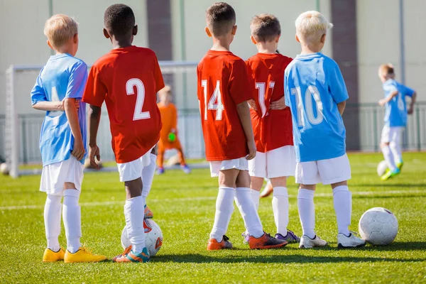 Kids Junior Football Training session. Soccer Training for Kids. Children Practice Soccer on the Pitch — Stock Photo, Image