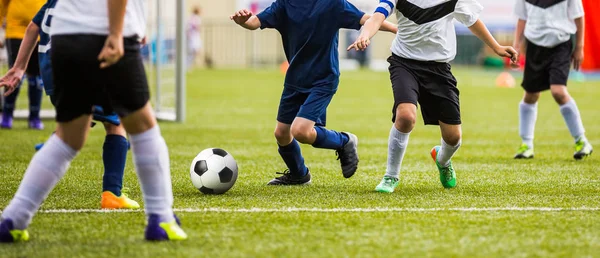 Kids kicking soccer match. Boys playing soccer tournament game on pitch — Stock Photo, Image