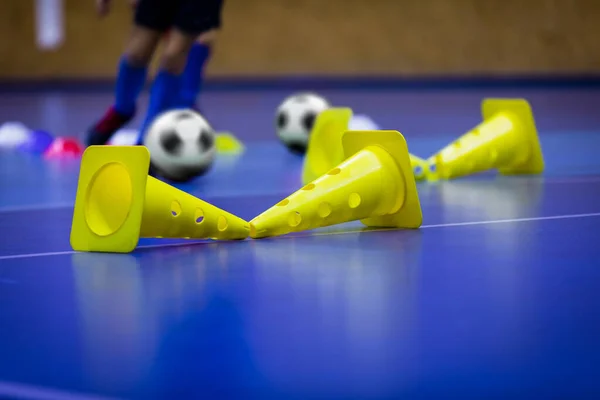 Futsal Indoor Soccer Football Training. Indoor Soccer Training Drill With Cones. Young Players on Futsal Practice