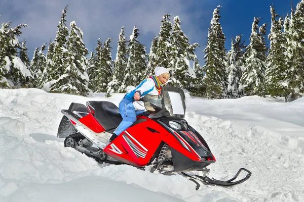 Woman riding snowmobile — Stock Photo, Image