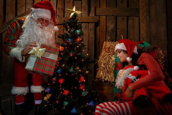 Santa Claus with sleeping woman — Stock Photo, Image