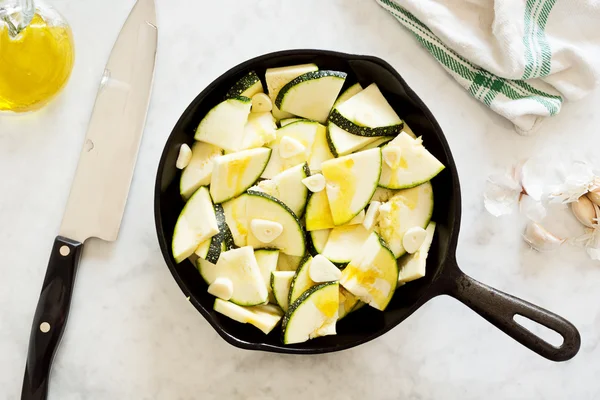 Chopped Zucchini (Courgette) and Garlic in Cast Iron Pan — Stock Photo, Image