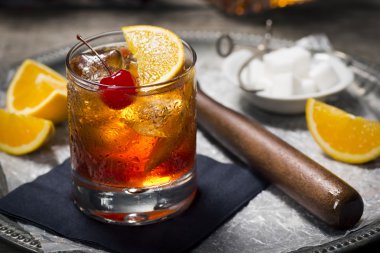 Old Fashioned Cocktail in Rocks Glass on a Vintage Bar clipart